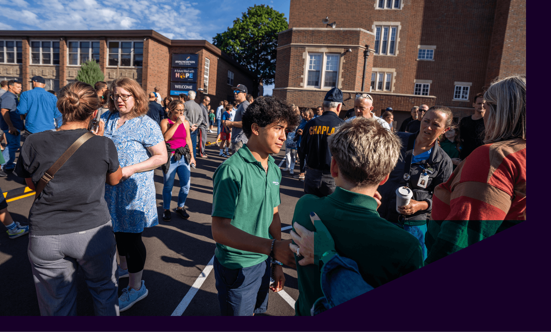 Students and parents await news during active shooter situation at the Annunciation Church in Minneapolis, Minn